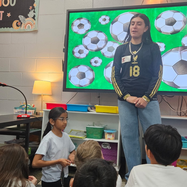 Soccer player talking to 3rd graders
