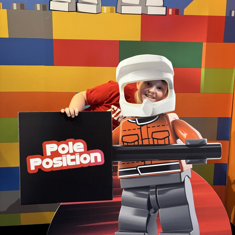 Student posing in a LEGO figure cutout