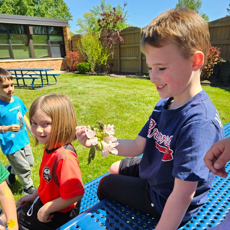 students holding a butterfly 