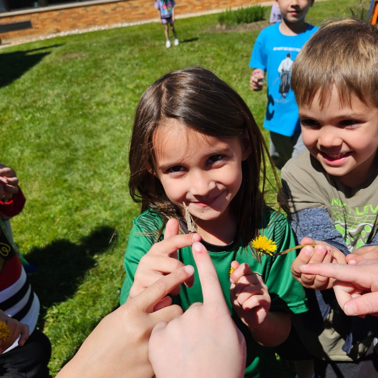 students holding a butterfly 