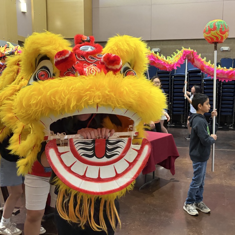 students participating in a lion dance