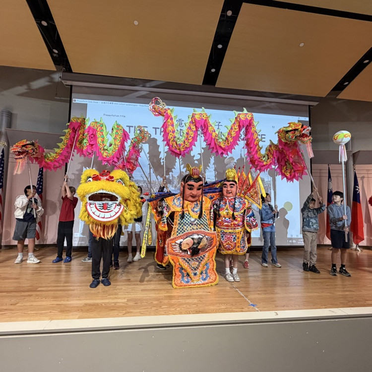 students participating in a lion dance