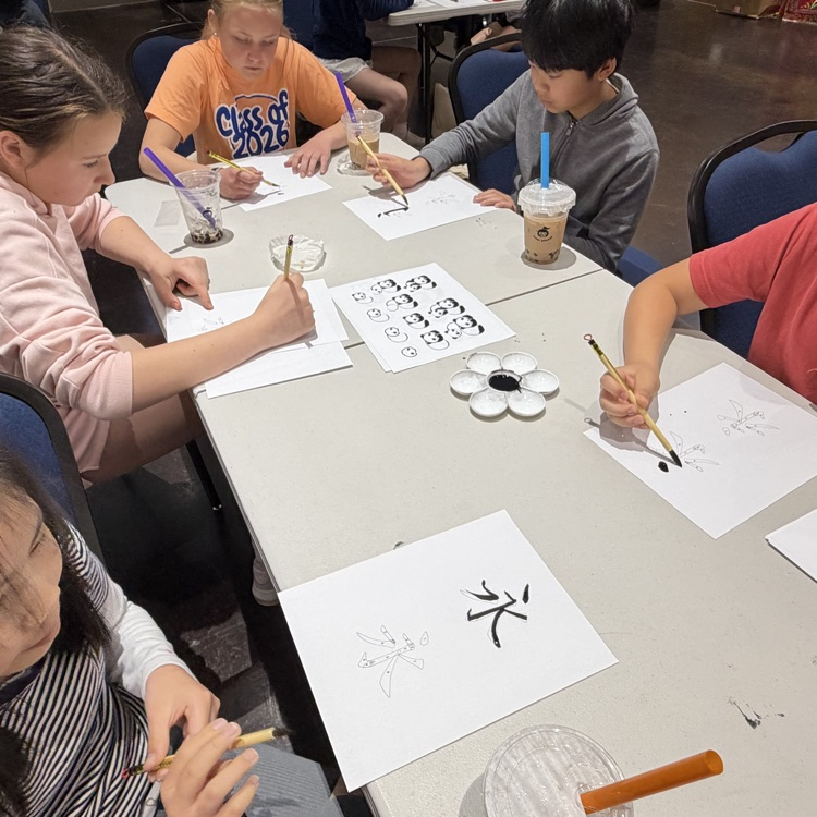 students working on Chinese writing 