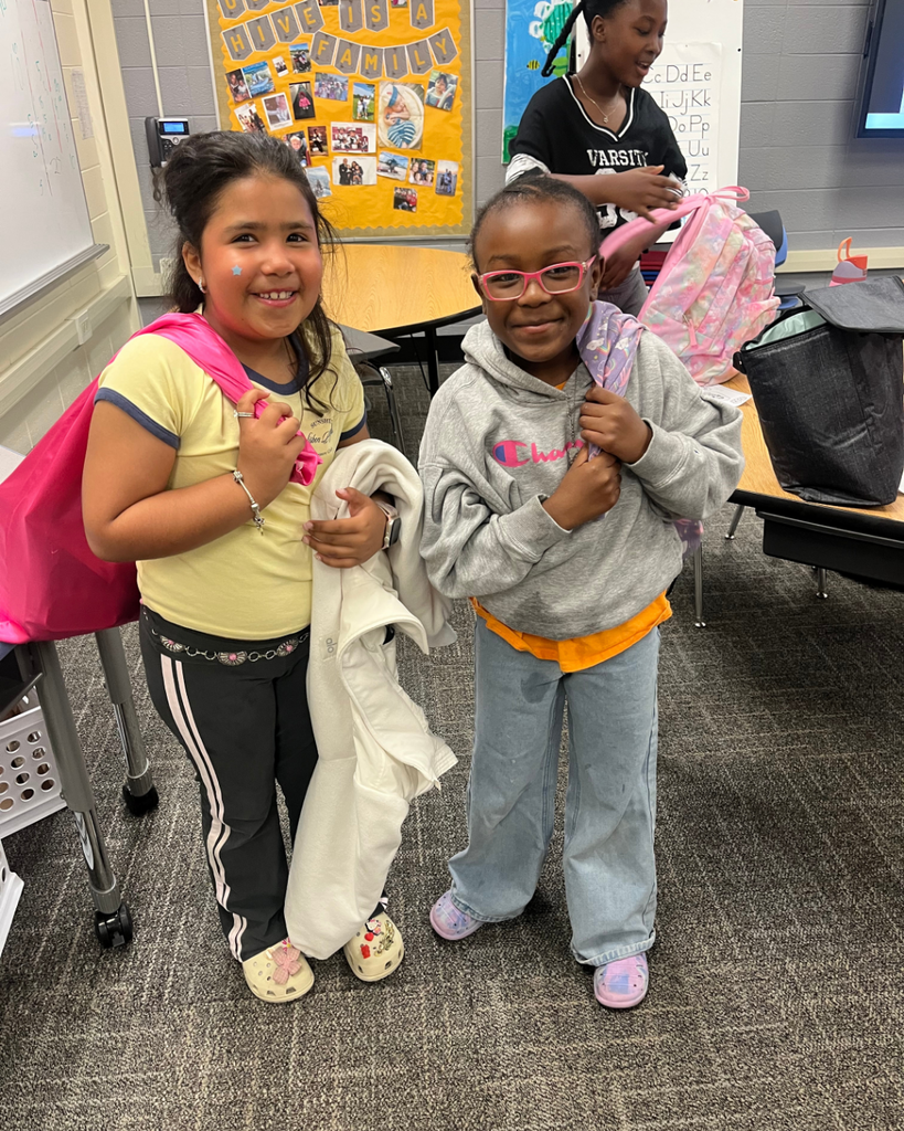 Students carrying pillocases as backpacks