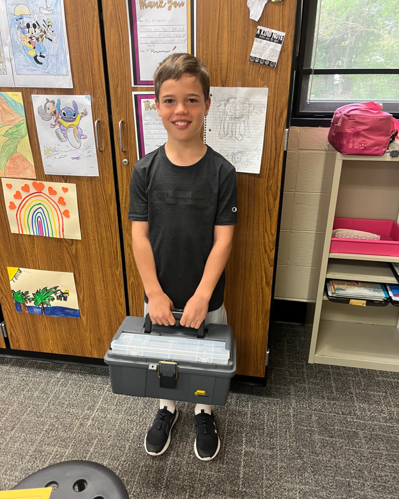 Student holding a toolbox