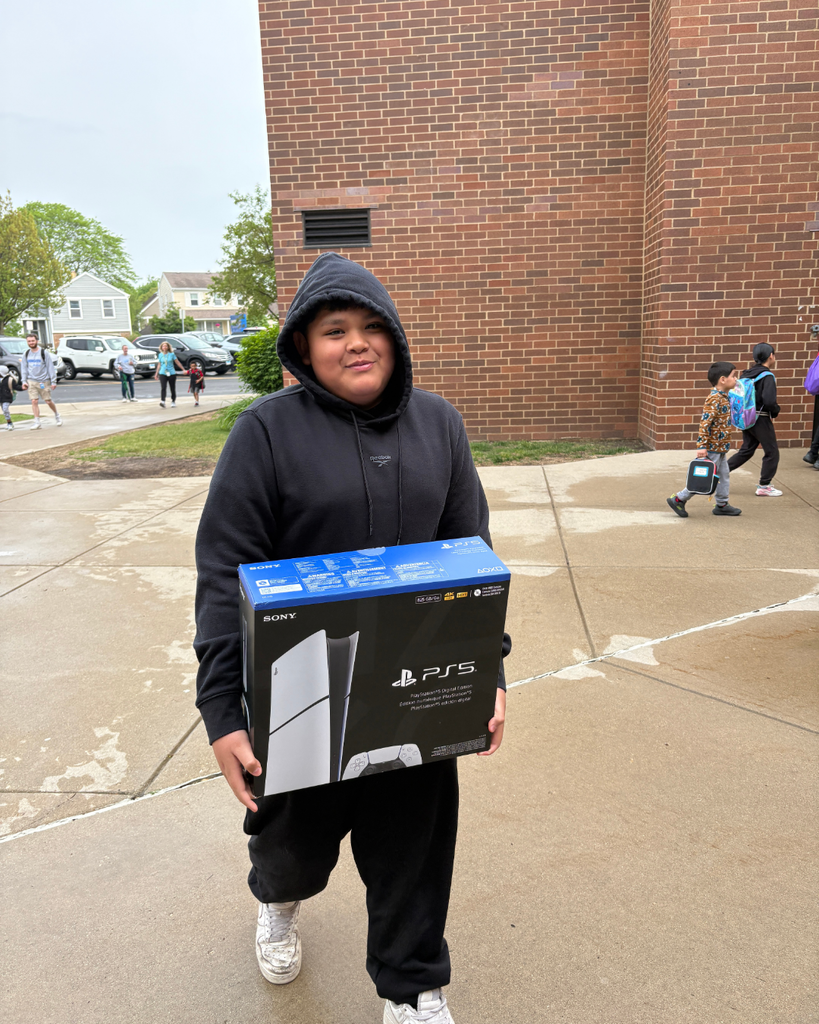 Student carrying a PS5 box as a backpack into school