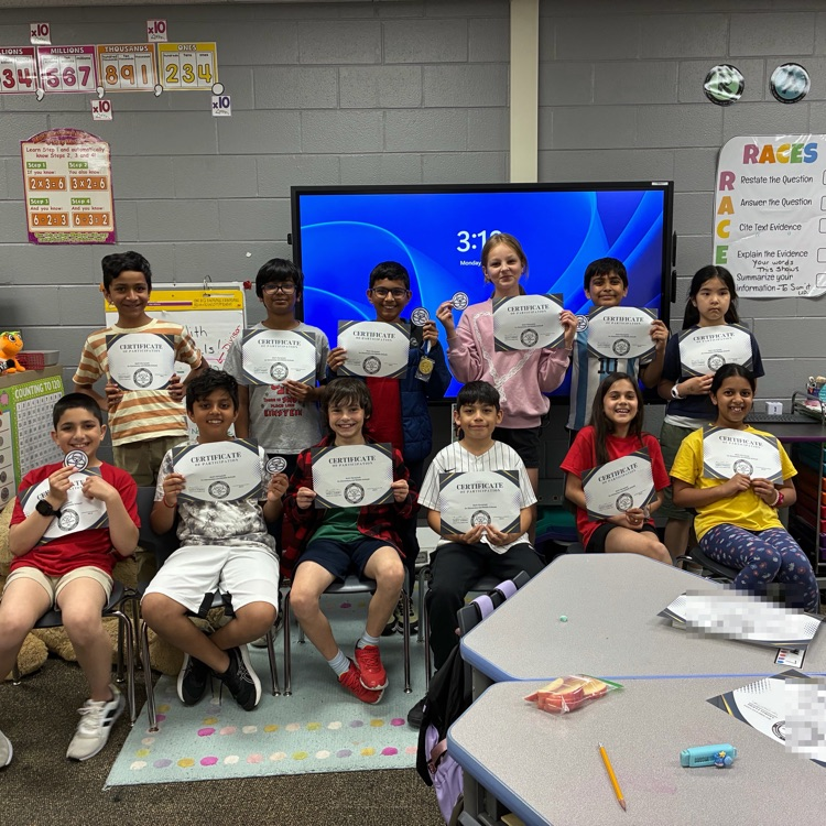 Math Olympiad students holding certificates