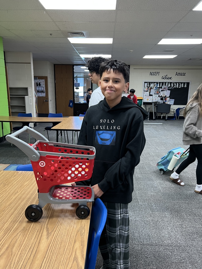 a student with a mini shopping cart as a backpack