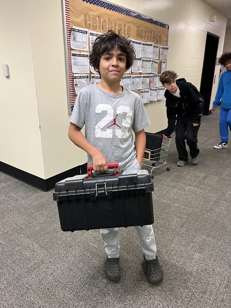 a student with a toolbox as a backpack