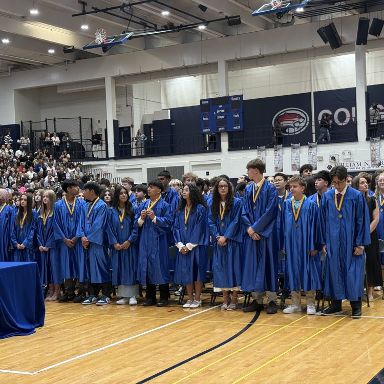 graduates in blue gowns