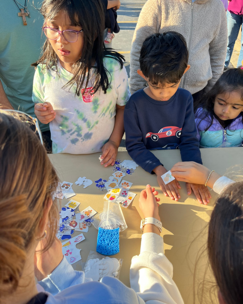 Students putting on temporary tattoos