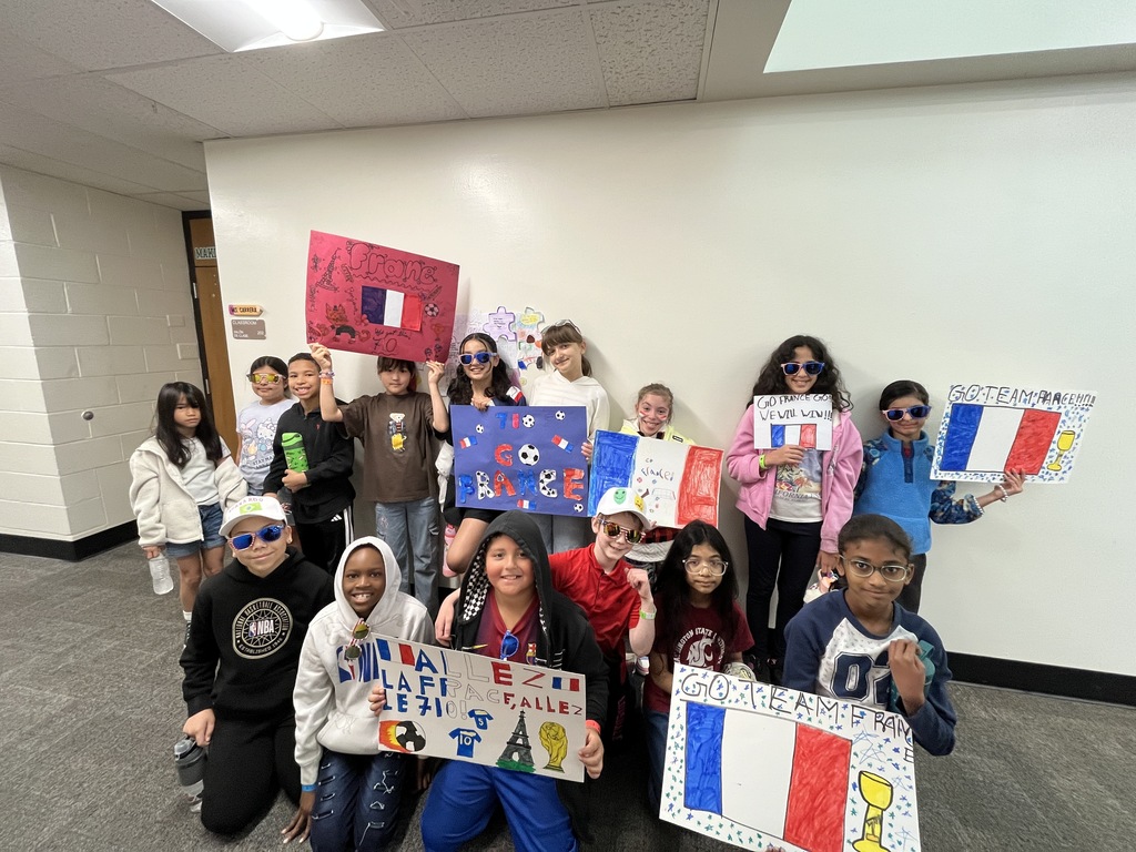 Students holding France posters
