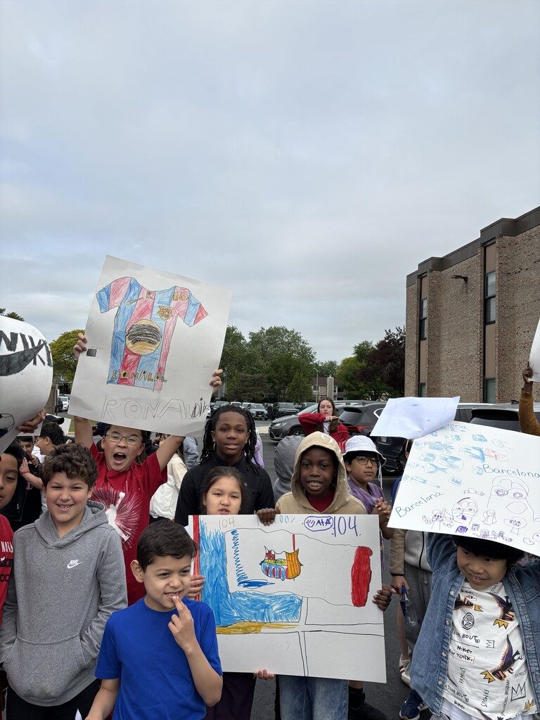 Students holding Barcelona posters