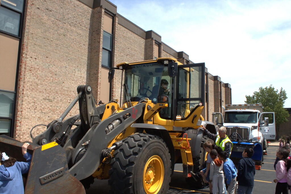 Students looking at a tractor