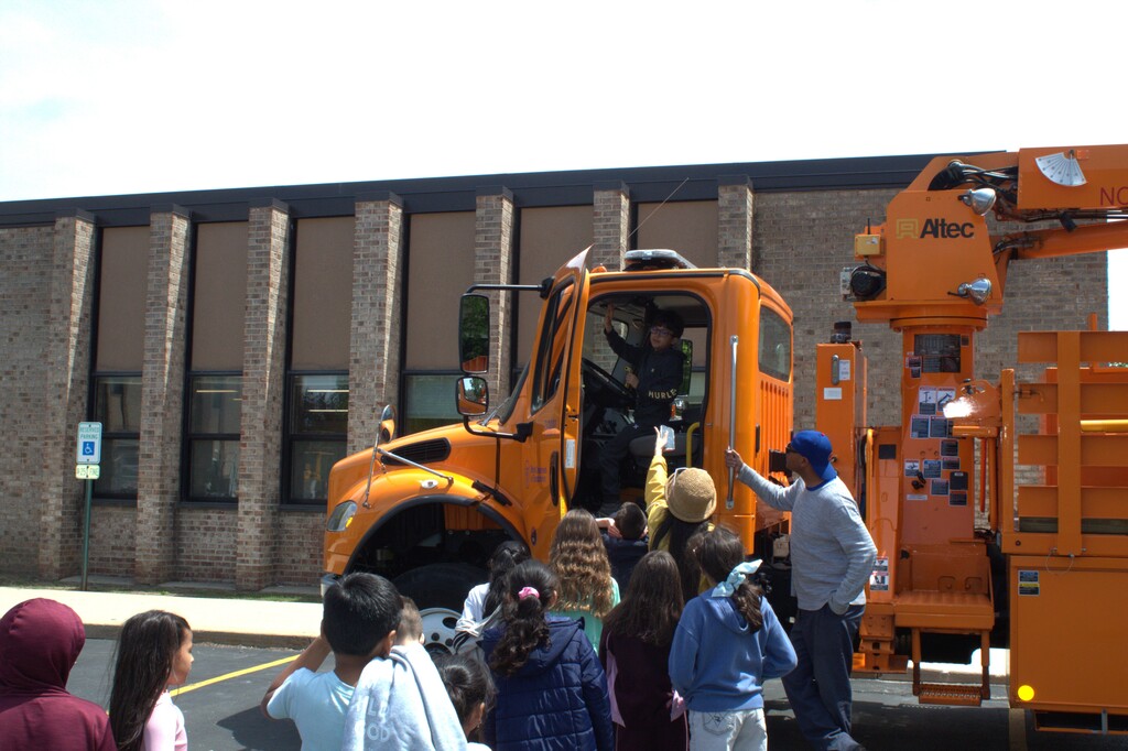 Students looking at a truck