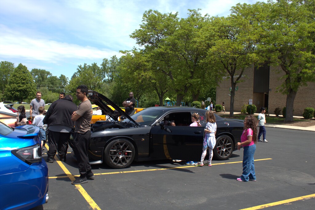 Students looking at a car