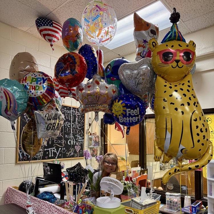 Mrs Carrigan with a bunch of balloons 