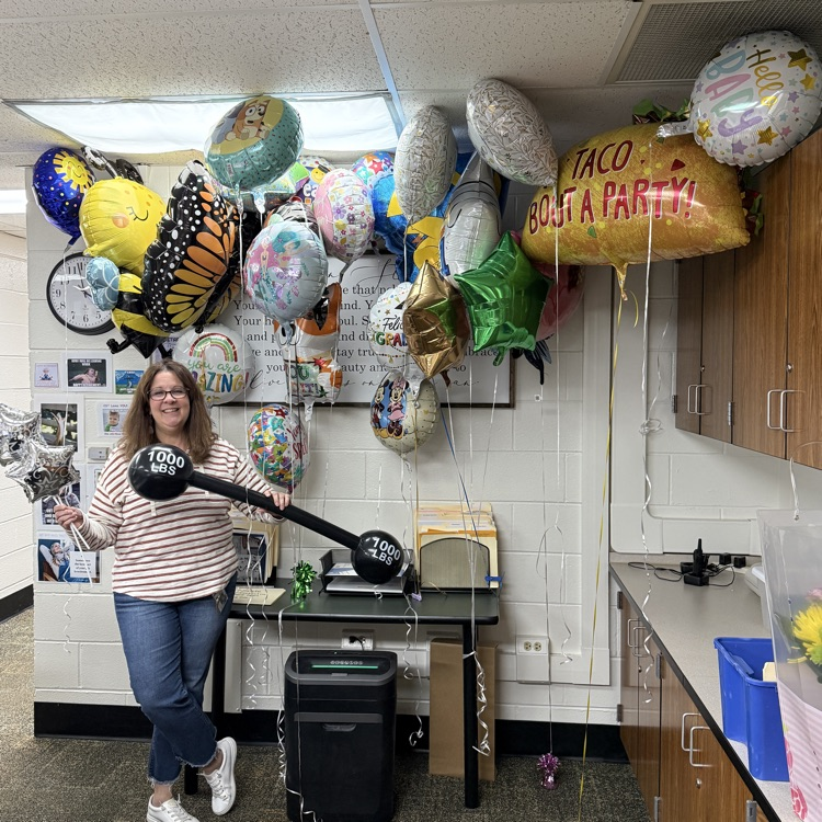 Mrs Majeske with a bunch of balloons 