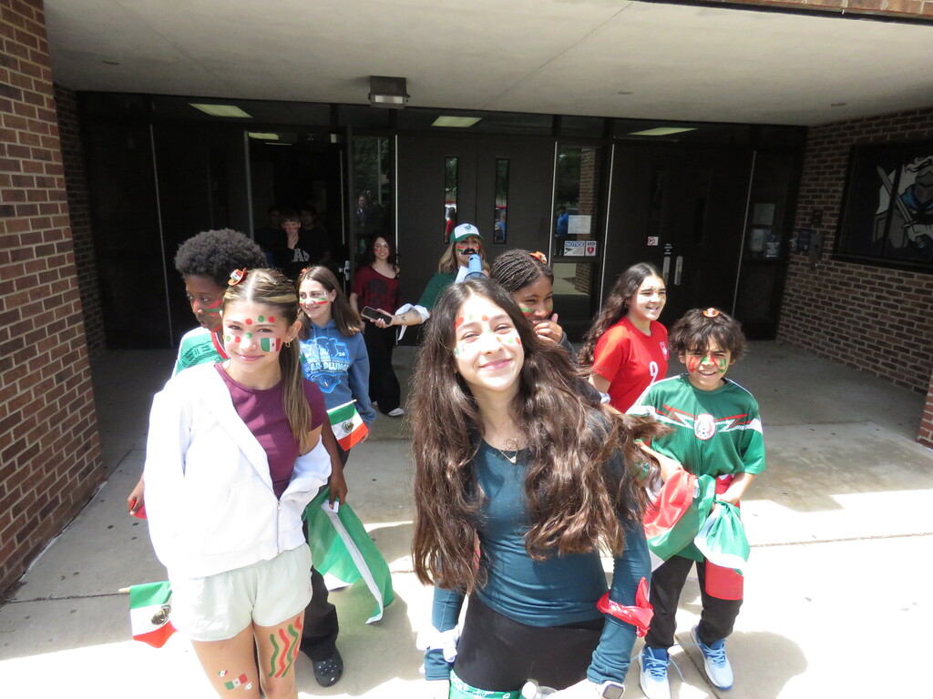 students posing as a team