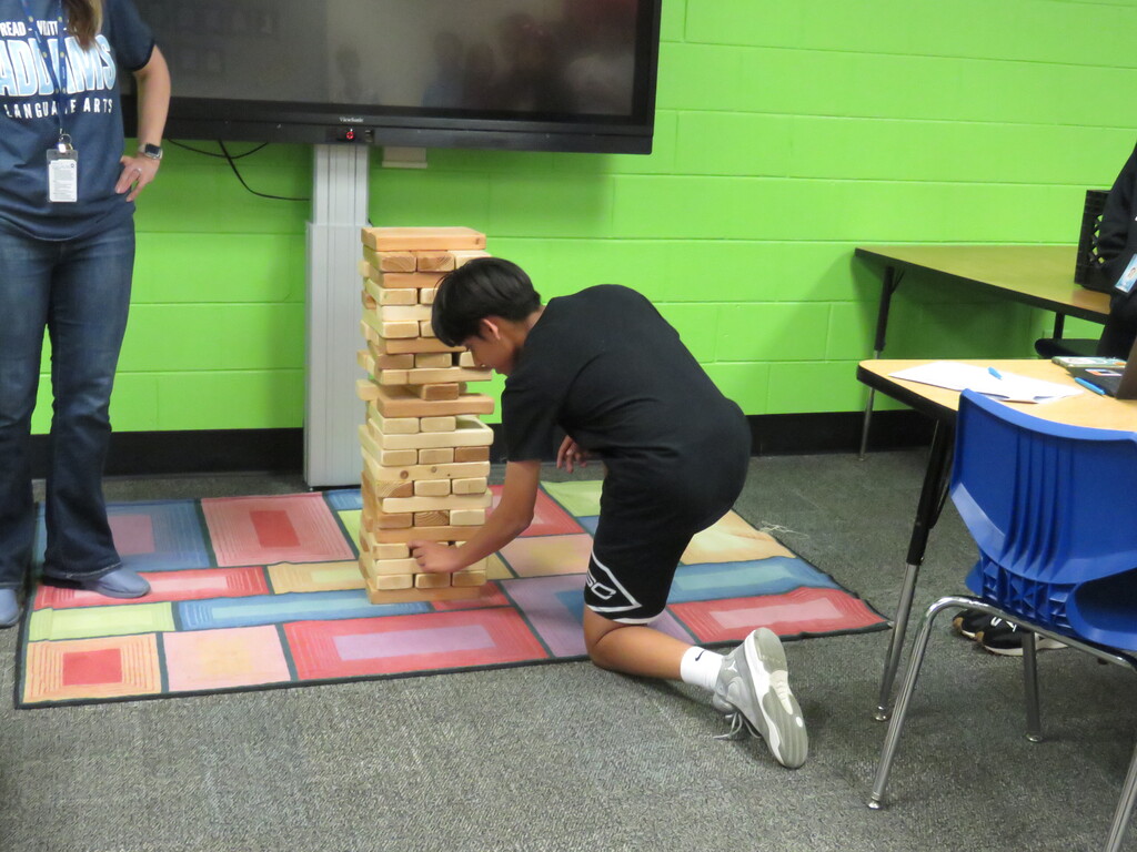 student playing jenga