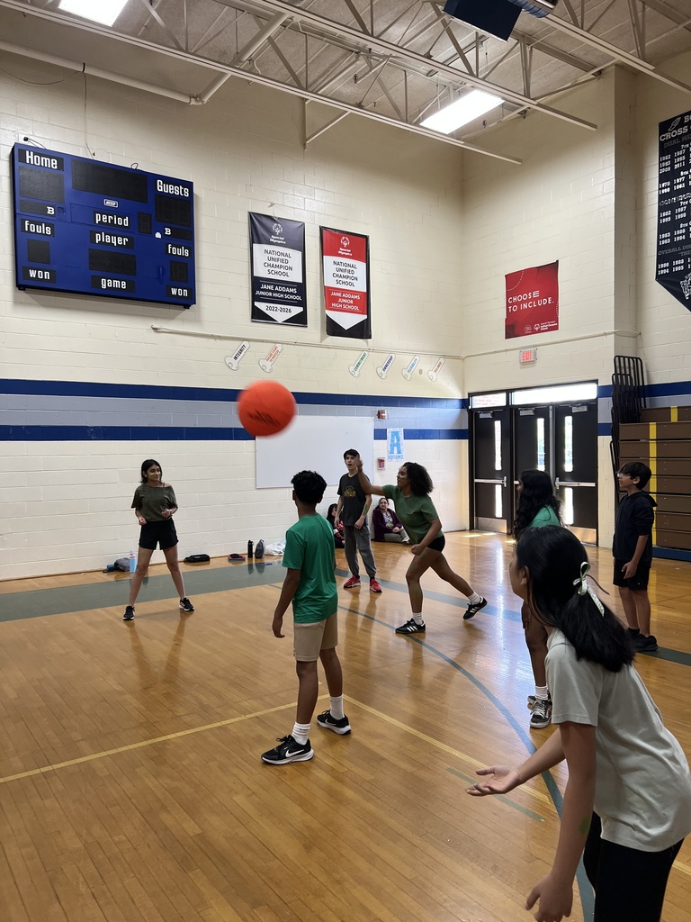 students playing volleyball