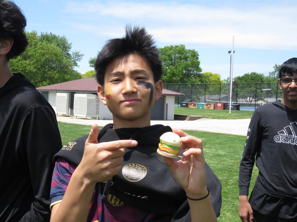 student holding up a toy