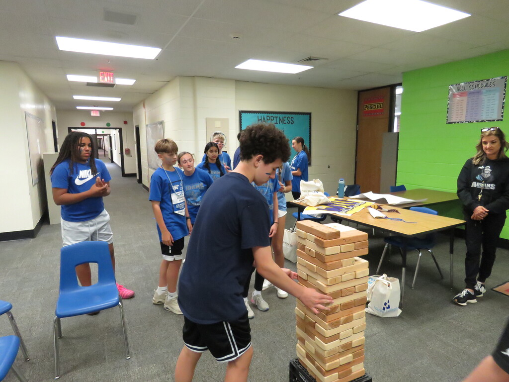 student playing jenga