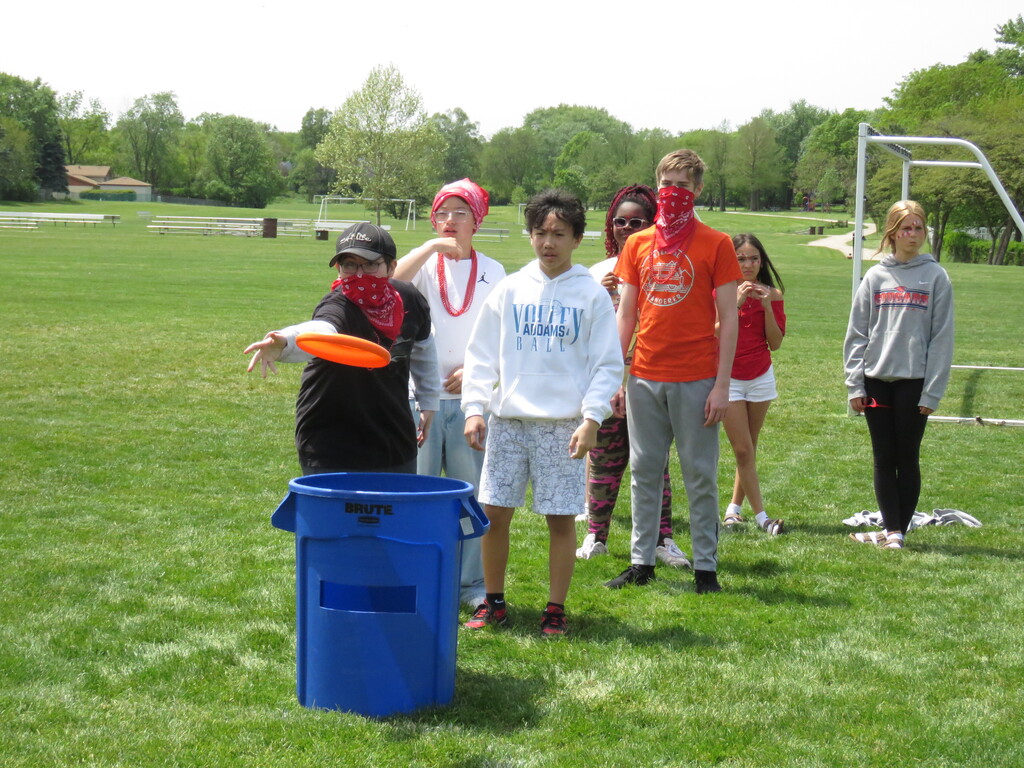 student throwing a frisbee