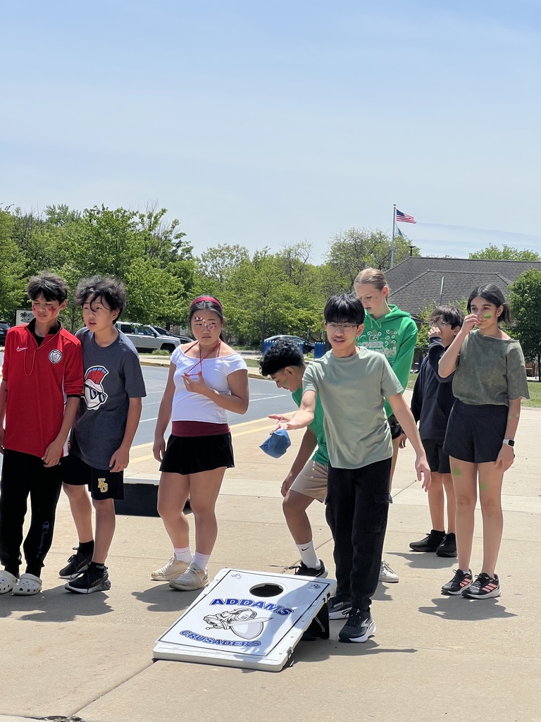 students playing cornhole