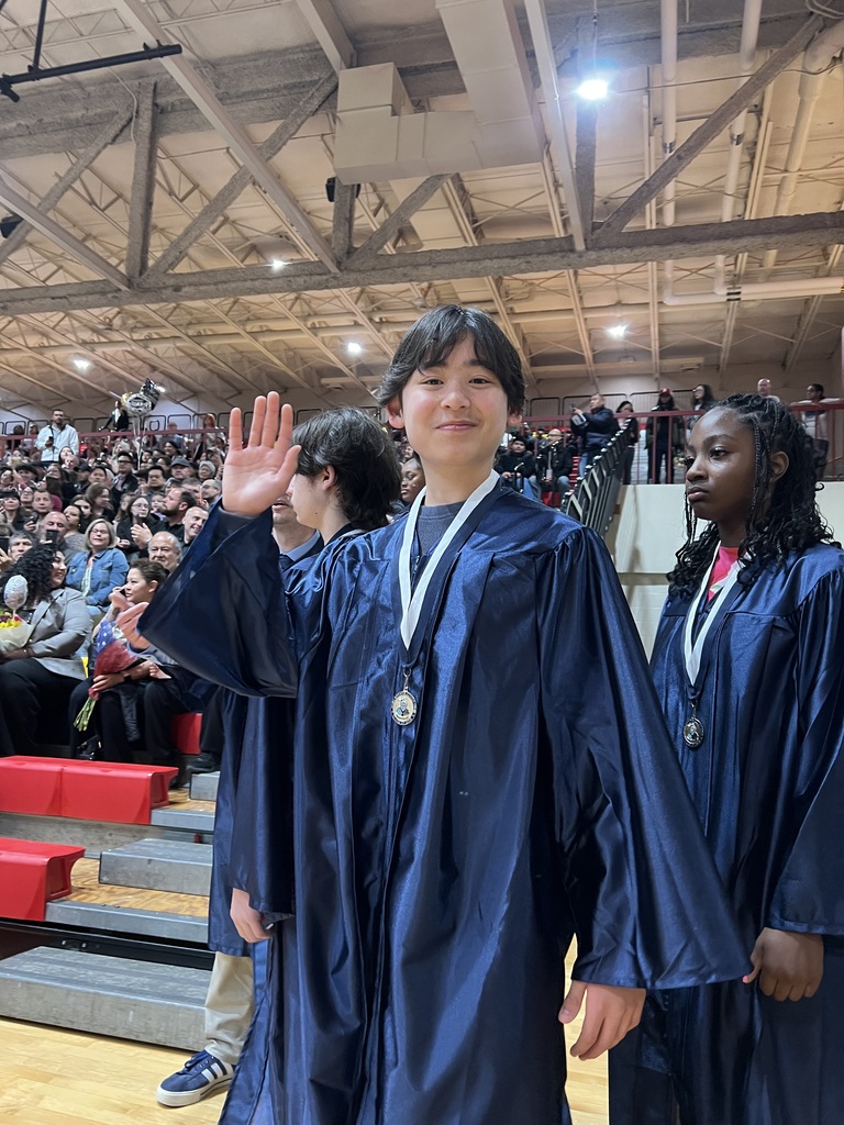 student waving