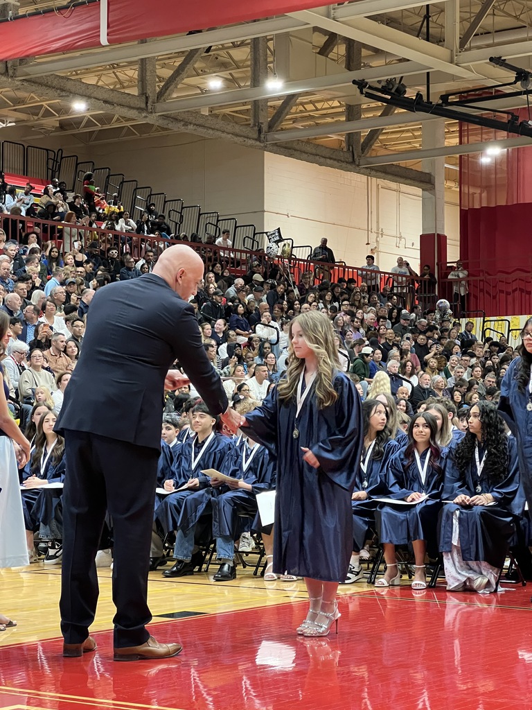 student receiving diploma