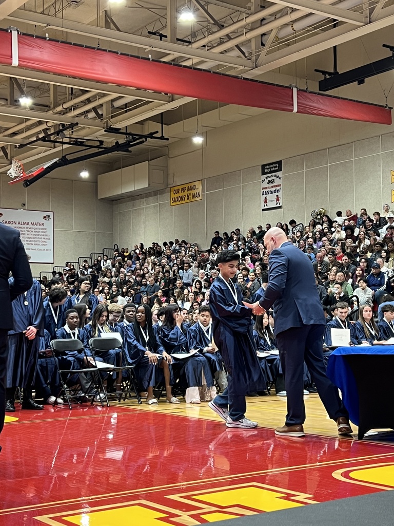 student receiving diploma