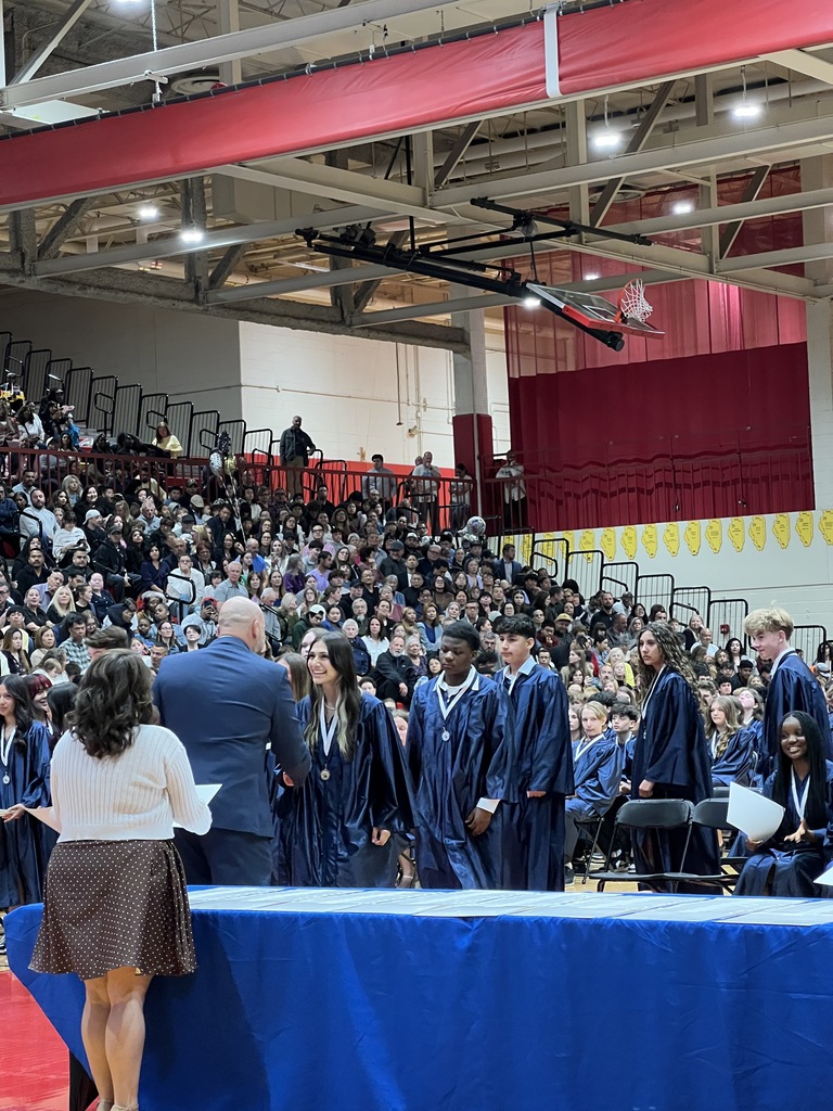 student receiving diploma