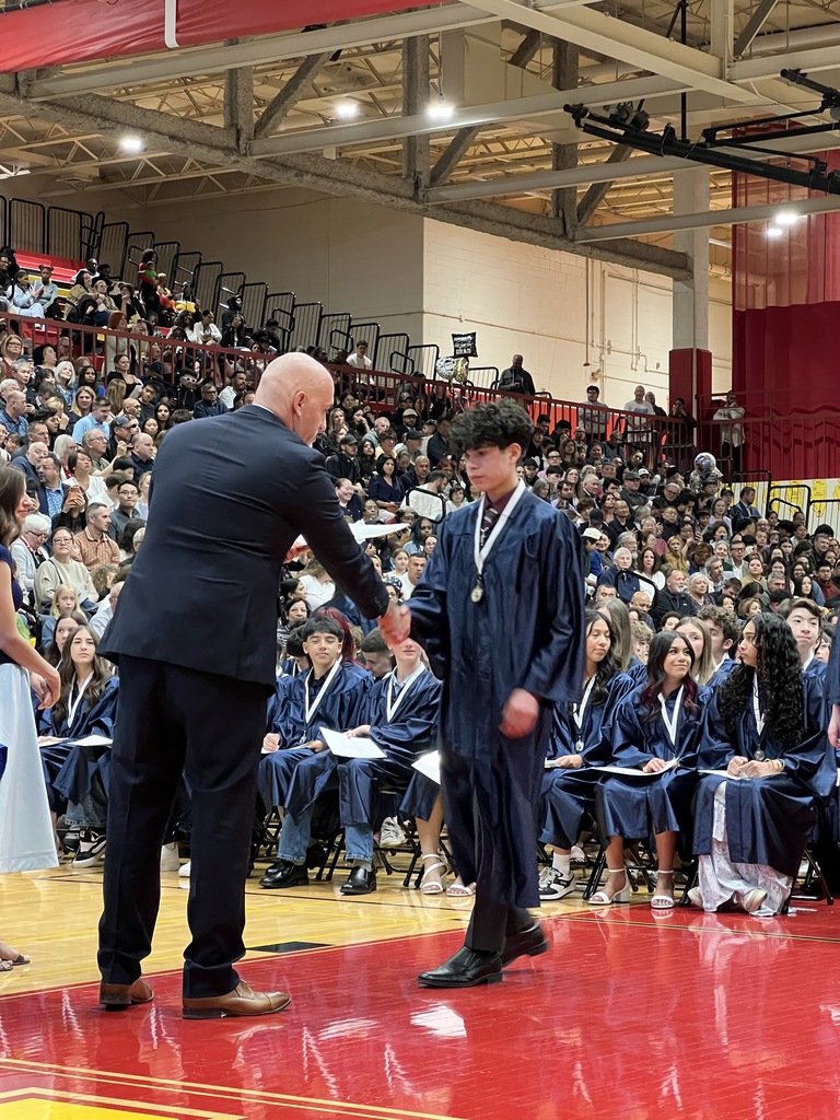 student receiving diploma