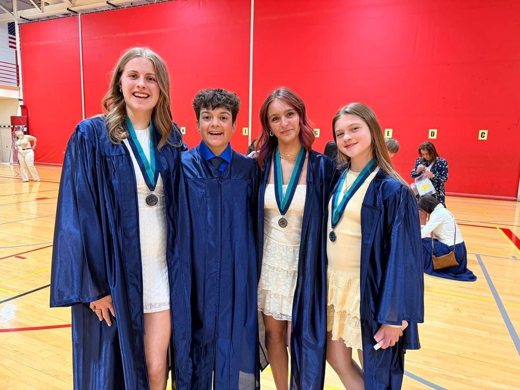 4 students are dressed to impressed at the 8th Grade Keller Junior High Graduation on May 21st. 