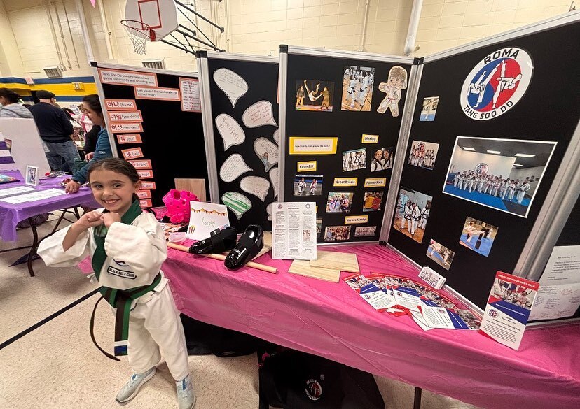 Student advertising her taekwondo booth
