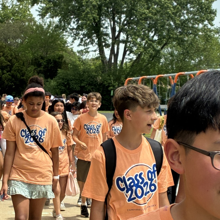 students walking in the 6th grade parade 