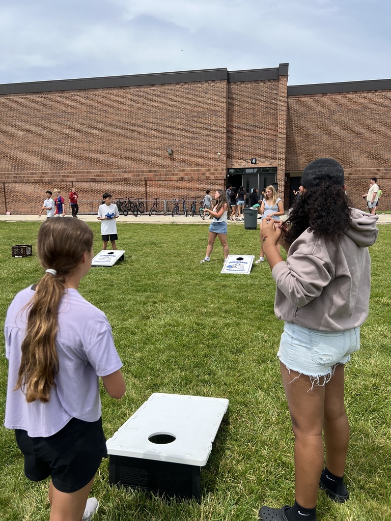 Students playing corn hole