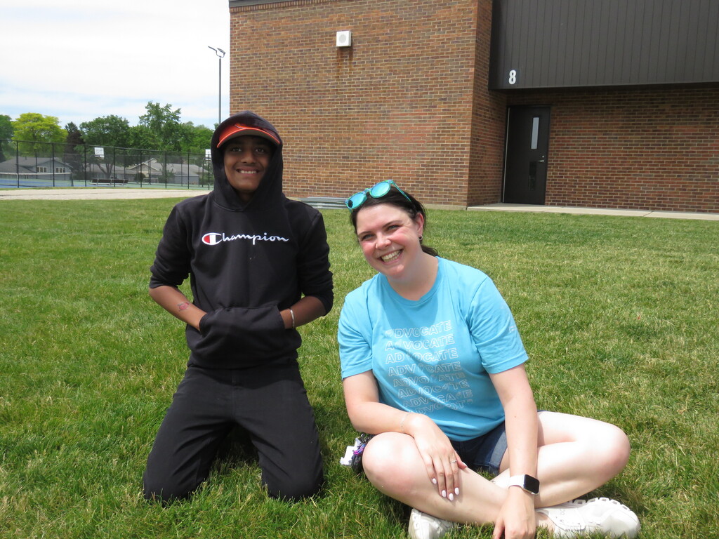 student and teacher smiling