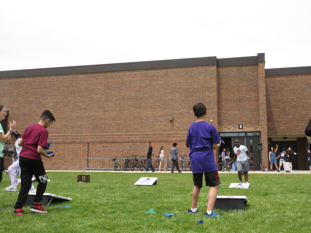 Students playing corn hole