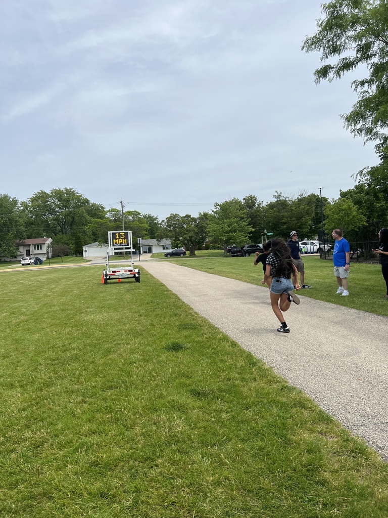 students running while a police radar checks their speed