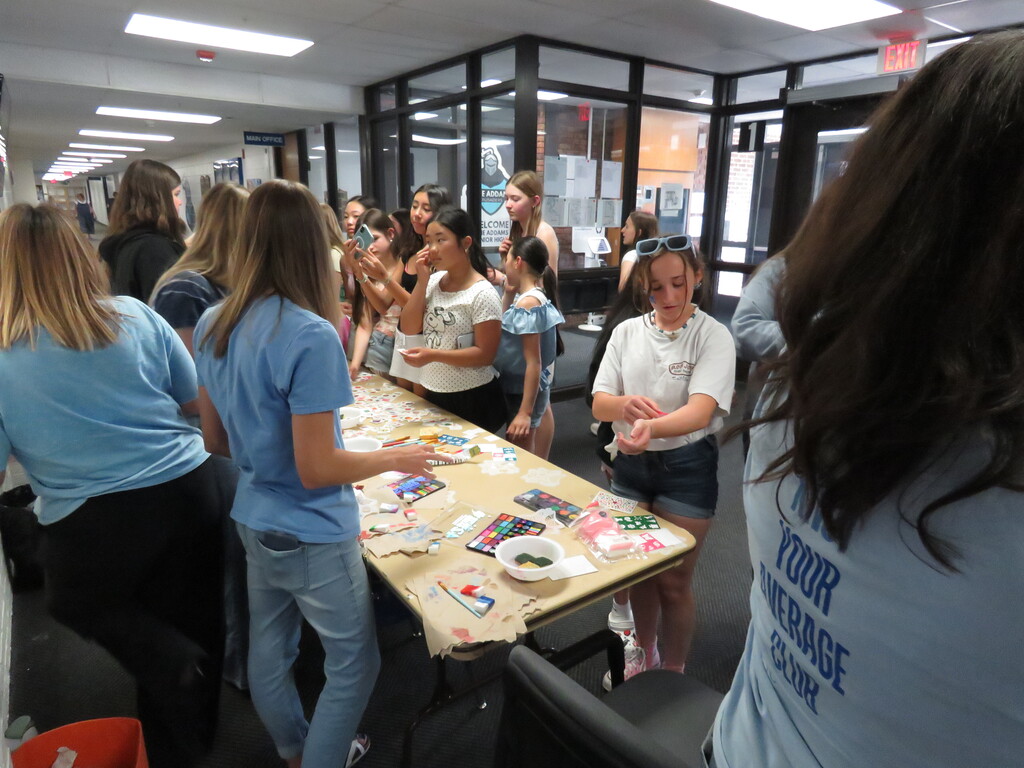 Students enjoying face painting