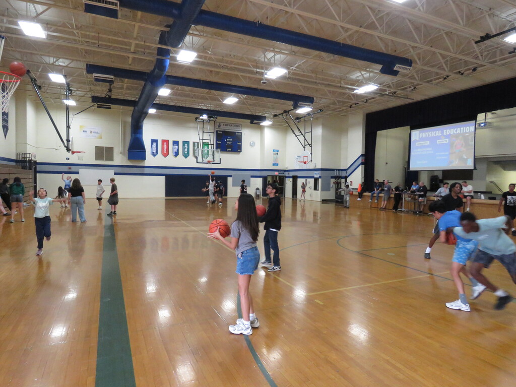 students playing basketball