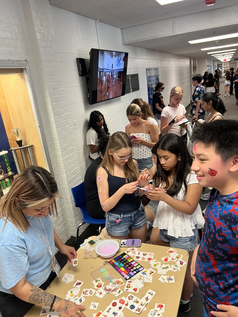Students enjoying face painting