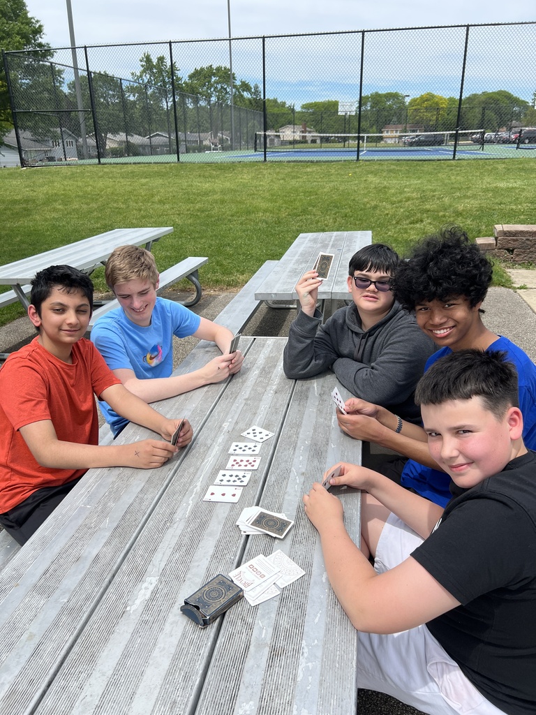 students posing with friends