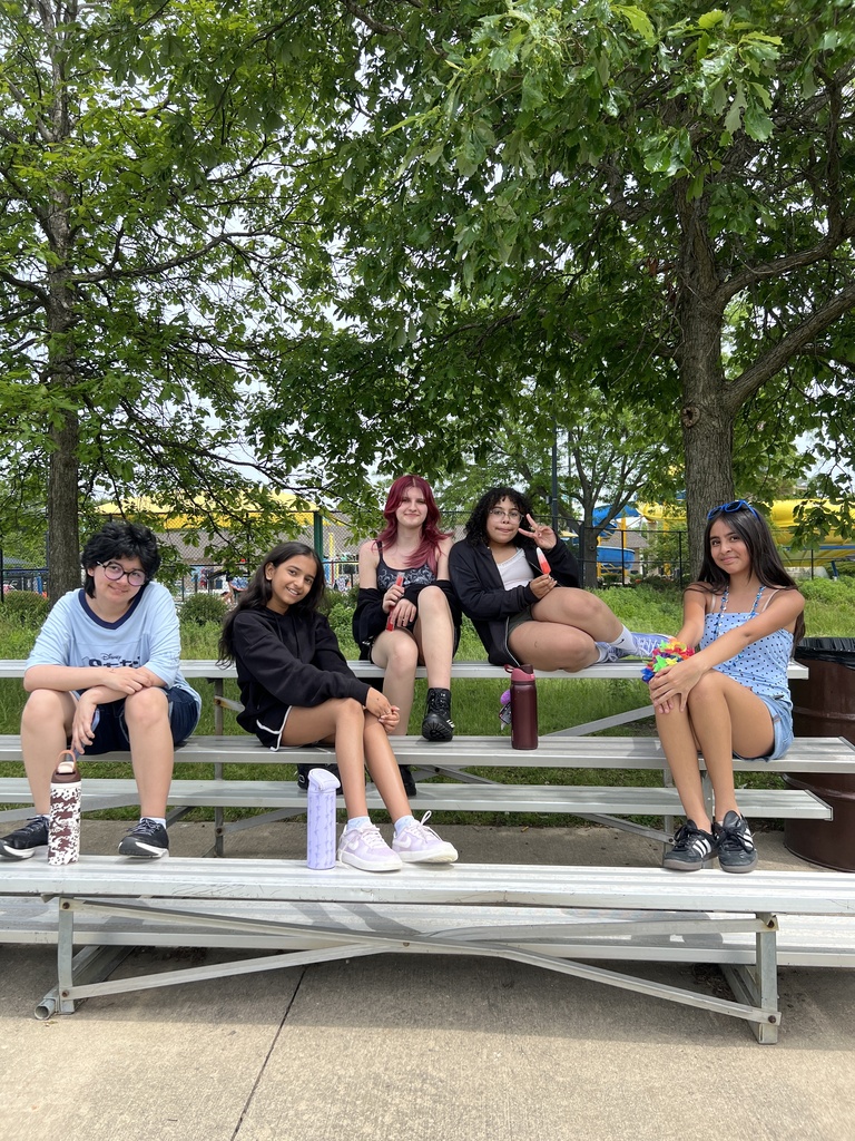 students posing with friends