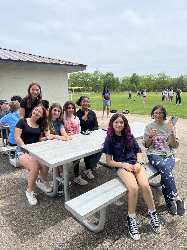 students posing with friends
