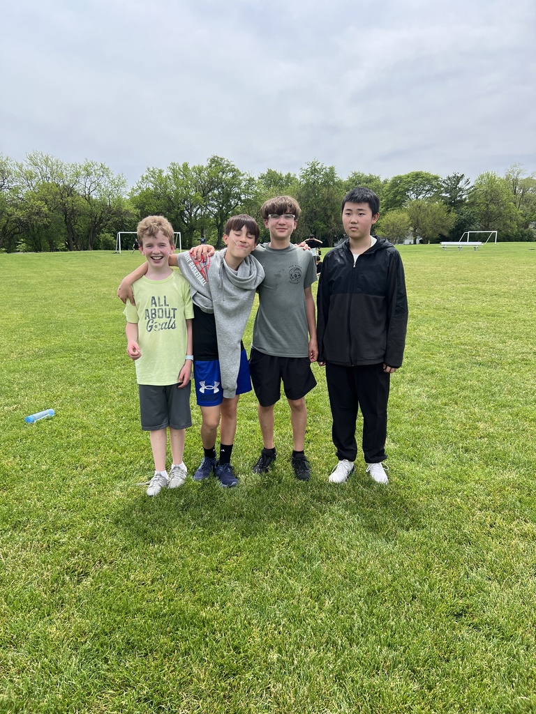 students posing with friends