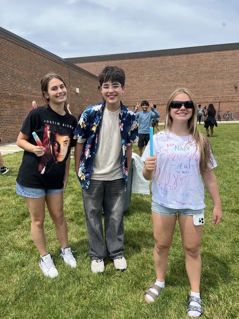 students posing with friends