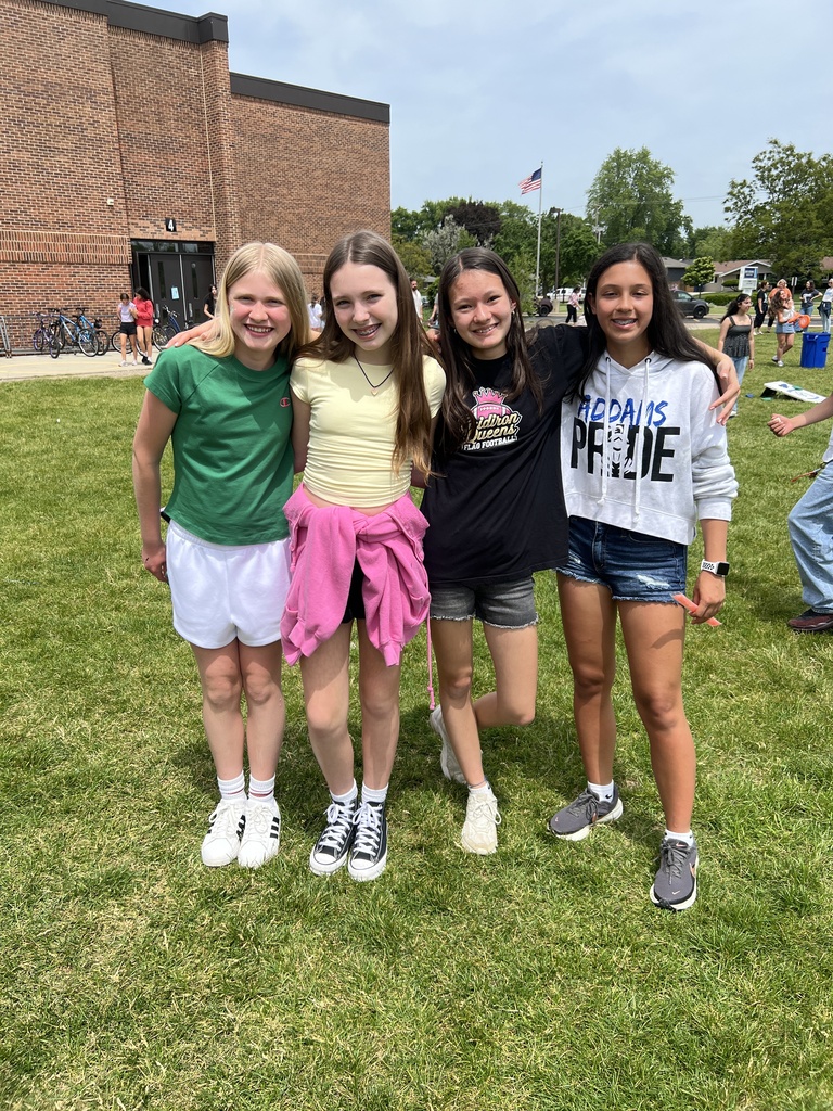 students posing with friends